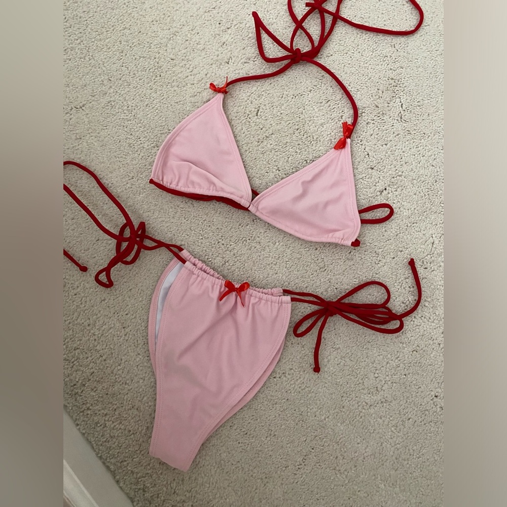 Pink bikini with red bows